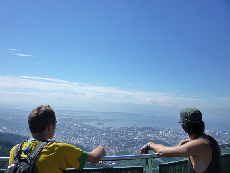 Lewi and Allen stare at the cityscape below