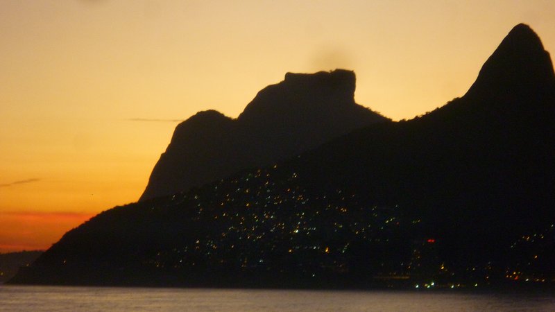 Lights begin to twinkle in Vidigal and the family on the rock go ahhh...
