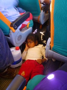cute girl asleep on crowded bus floor