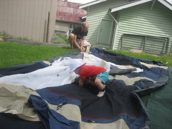 Maya and Grandad help put up the tent
