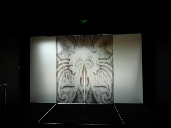 Maori art etched in glass door