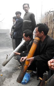 Hani men enjoying a smoke