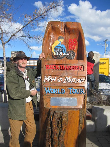 Artist Greg Sween and his carving from the original tour 25 years ago in Quenel