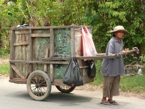 Local elder pulling cart