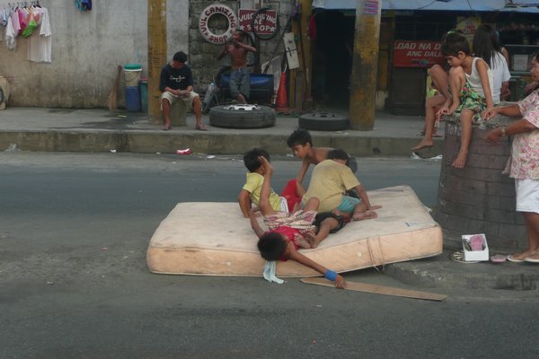 Jumping on a Matress on the Street