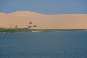 Lake Backdroped By Dunes