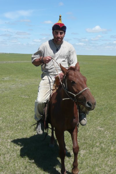 On A Horse With Mongolian Cap