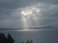 sun trying to get through the rain clouds on bryon bay