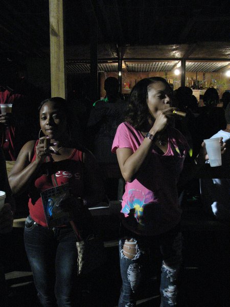 5. Girls enjoying a cigar at the Regatta festivities