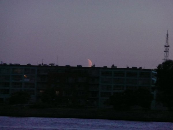 Moon over the opposite bank of river Daugava