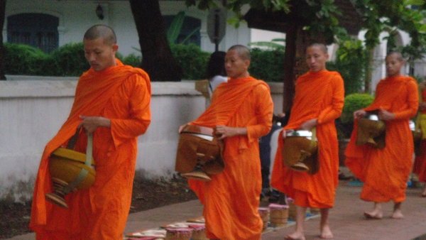 Monks collecting their offerings