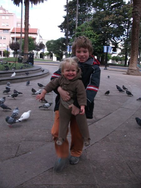 Amit and Maytal enjoying the birds in the plaza