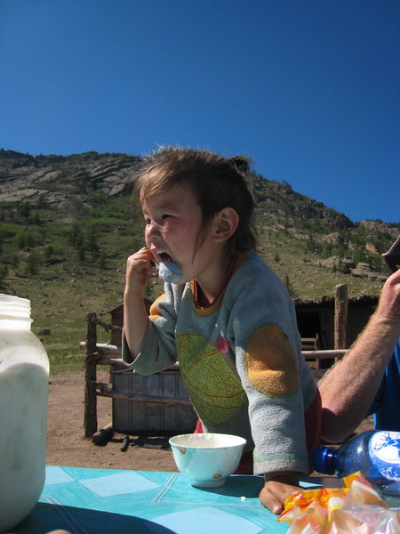Hurse licks the yoghurt off her spoon...