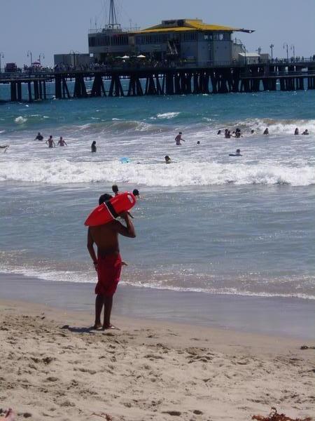 Lifeguard struts his stuff Baywatch style on Santa Monica Beach