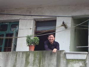 Funny man on his balcony