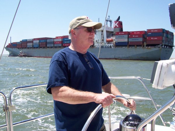 Douglas driving the boat on the Elizabeth River in Norfolk, Va