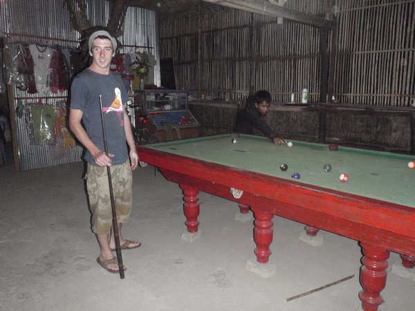 russ playing pool with a young khmer