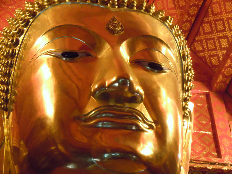 Face of giant golden Buddha