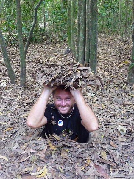 Ian entering the Cu Chi Tunnels