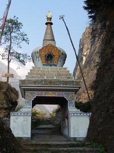 Stupa along the trail with prayer wheels inside