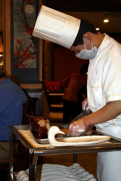 Chef carving the Peking duck