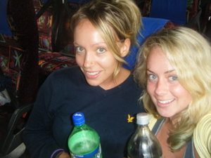 On the coach, drinks in hand
