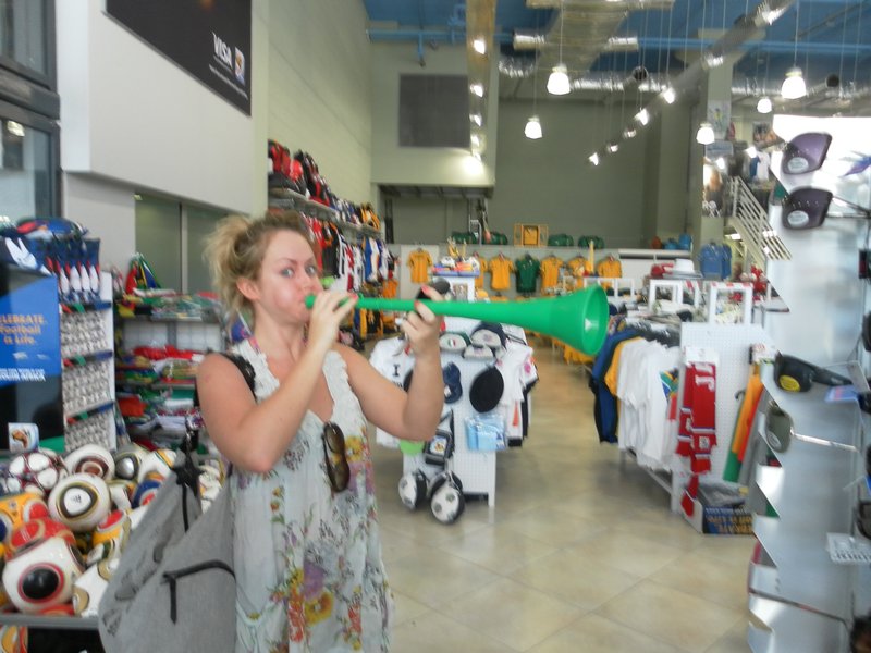 Blowing a vuvuzela 