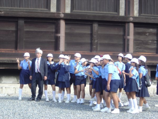 Japanese schoolchildren group at Sanjusangendo hall