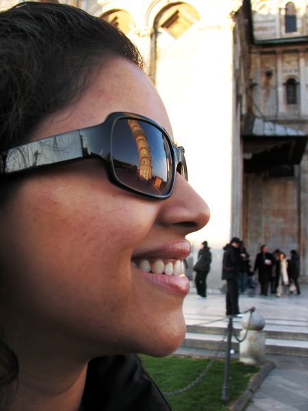 Reflection of the tower off Luna's glasses.