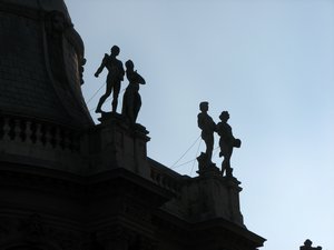 statues on top of one of the buildings at Vajdahunyad Castle