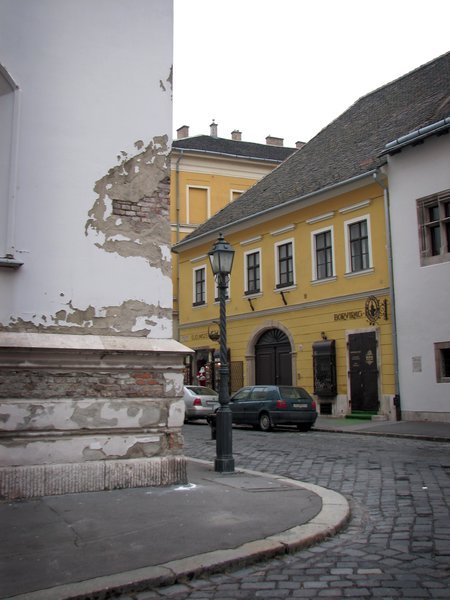 Street corner in Castle Hill with damaged building.
