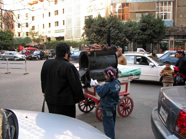 Street vendor in Cairo selling sweet potatoes.