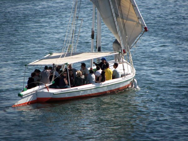 Tour group sailing off in their felucca.
