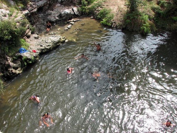 Kids swimming in the town's river.
