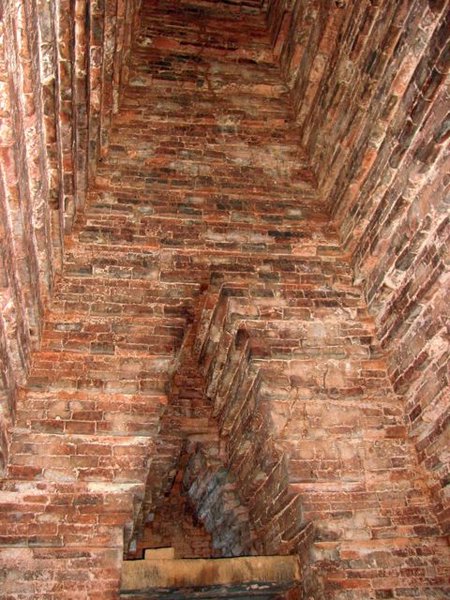 inside one of the temples at My Son- looking up one of the inner walls