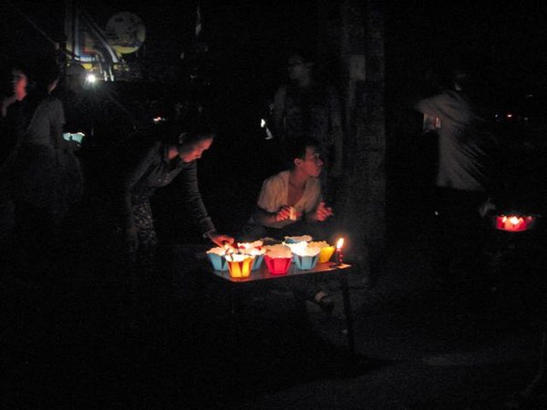 Locals selling lanterns to celebrate the full moon.