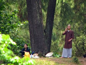 yes, monk looking man, we see you using your cell phone!