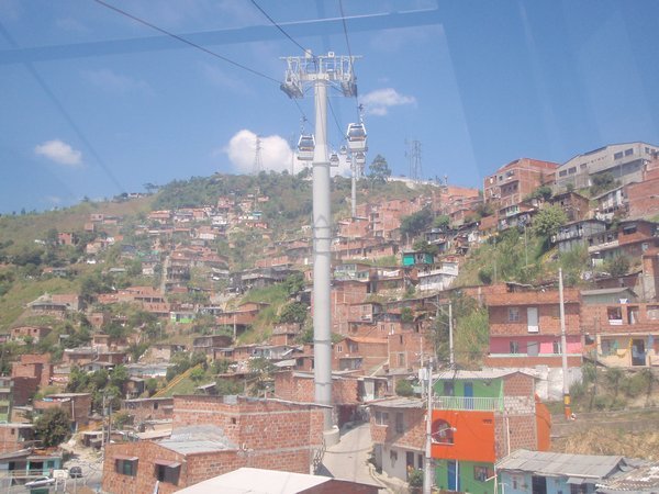 In the sky metro in Medellin view of slum below