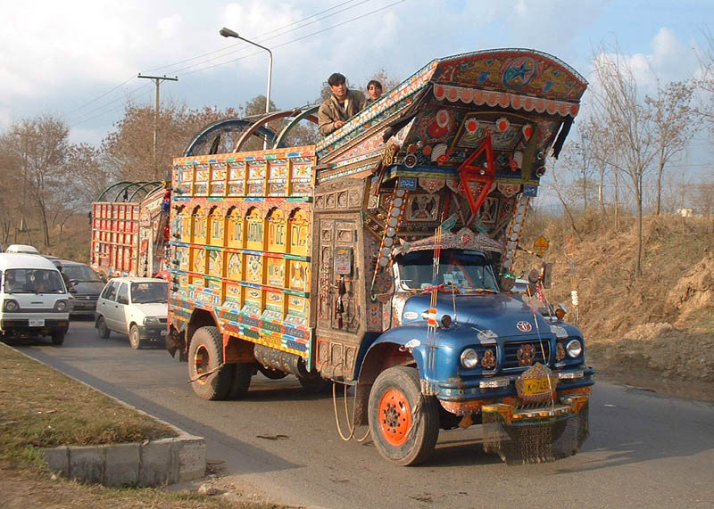 Pakistani Painted Truck Holding up Cars