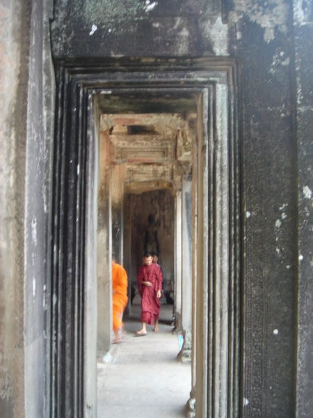 Munks walking through Angkor