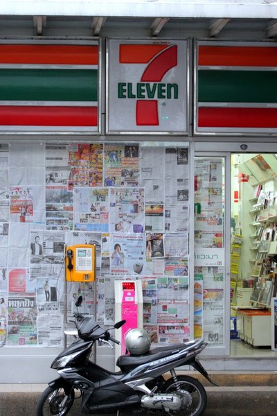 7/11 with newspaper covering the glass to counter snipers