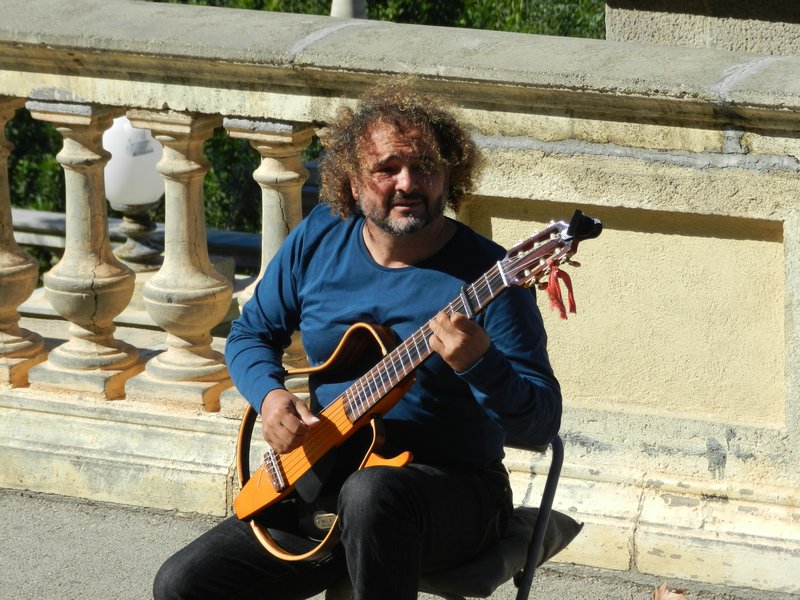 Amazing Classical guitar player in front of the National Museum of Catalonia Art