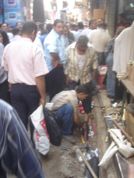 Bazar Electrician making a mains join during a power-cut