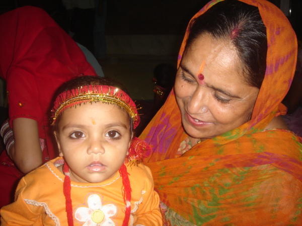 Hindu kid with mum at temple