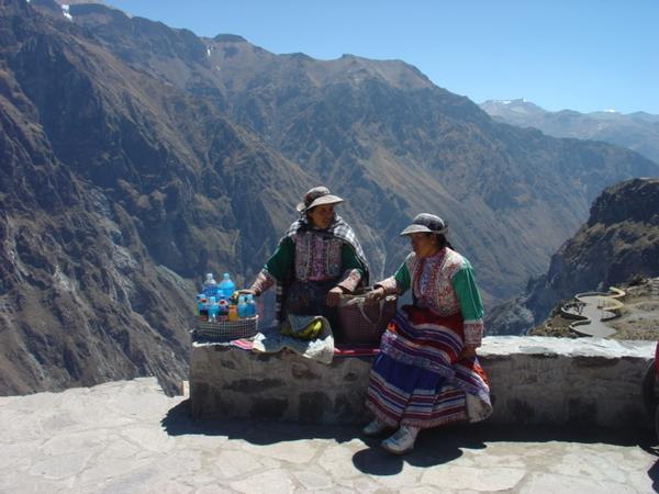 A couple of locals in traditional dress to sell water at the top of the canyon