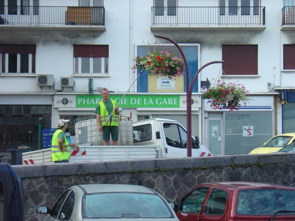 French guy watering the plants