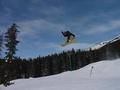Joel biffing a 180 over the tables in the terrain park
