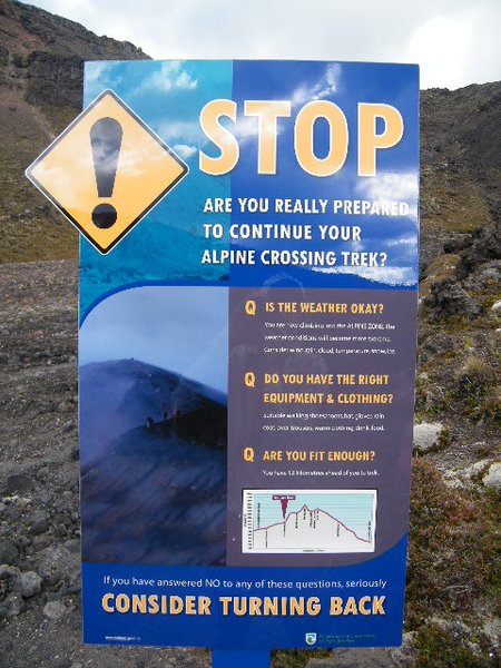 Warning sign at the base of the crossing