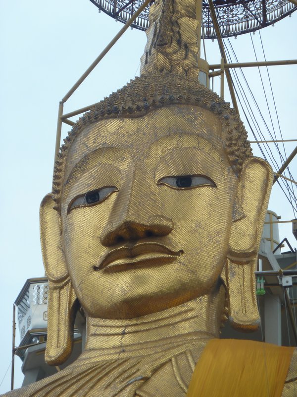 Giant golden Buddha close up