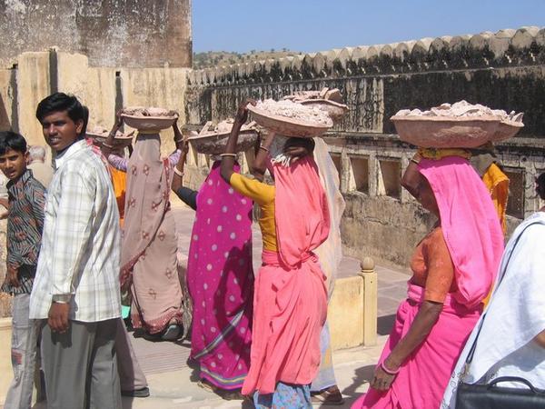 Workers Carrying Bricks